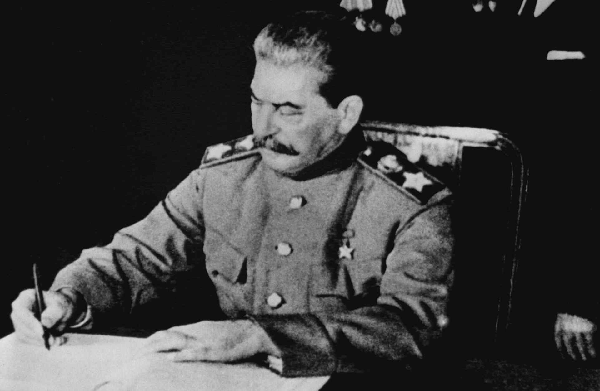 Joseph Stalin signing a treaty of friendship and mutual assistance between the USSR and Poland, April 21, 1945.