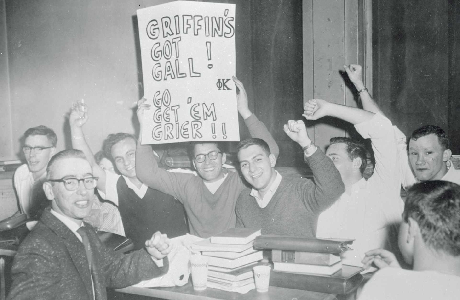 University of Pittsburgh students are shown holding aloft one of the signs which escaped seizure when University officials stopped a student demonstration before it got underway. Meanwhile the State Board of Regents in Georgia adopted a policy that would allow Georgia Tech to fill it's Sugar Bowl game with Pittsburgh which had a Negro fullback, Bobby Grier, on its team. Governor Marvin Griffin of Georgia had requested that Georgia teams not be allowed to participate in games against teams which had Negro players or where spectators were not segregated.