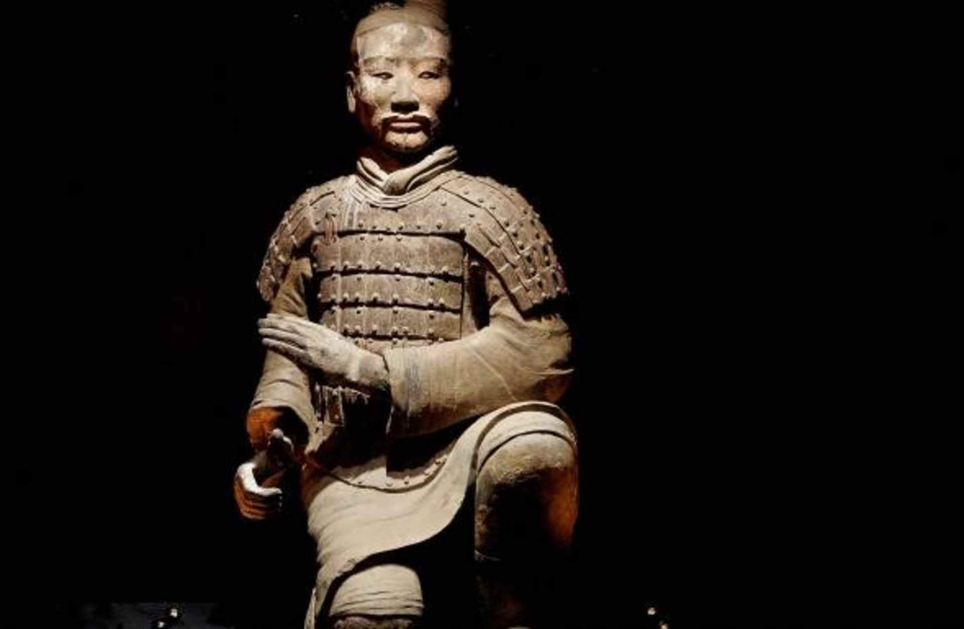 The figure of a kneeling archer on display at the British Museum.