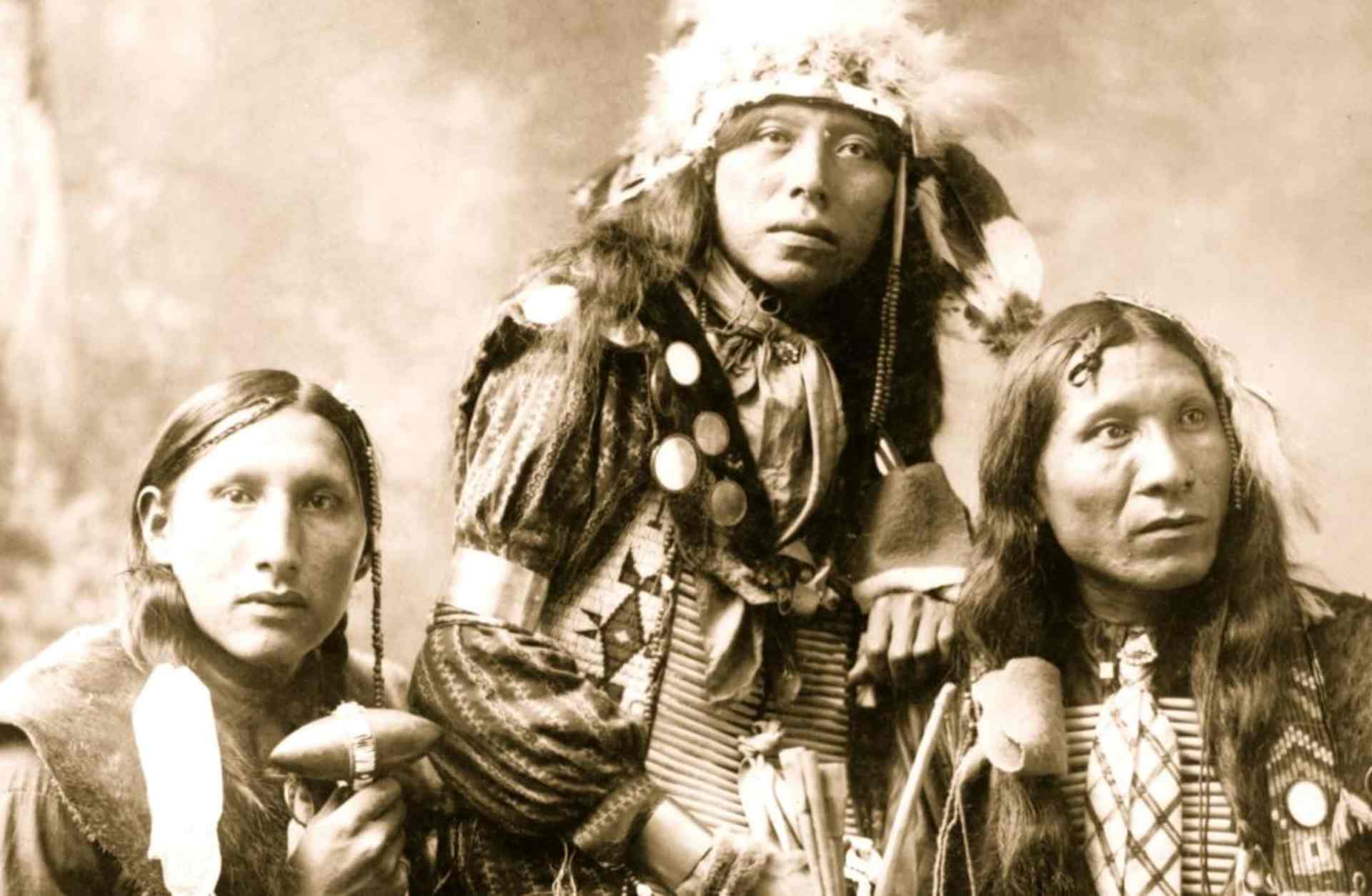 Three young Native American men, probably Sioux, wearing native accessories, 1899. (Photo by Heyn/Buyenlarge/Getty Images)
