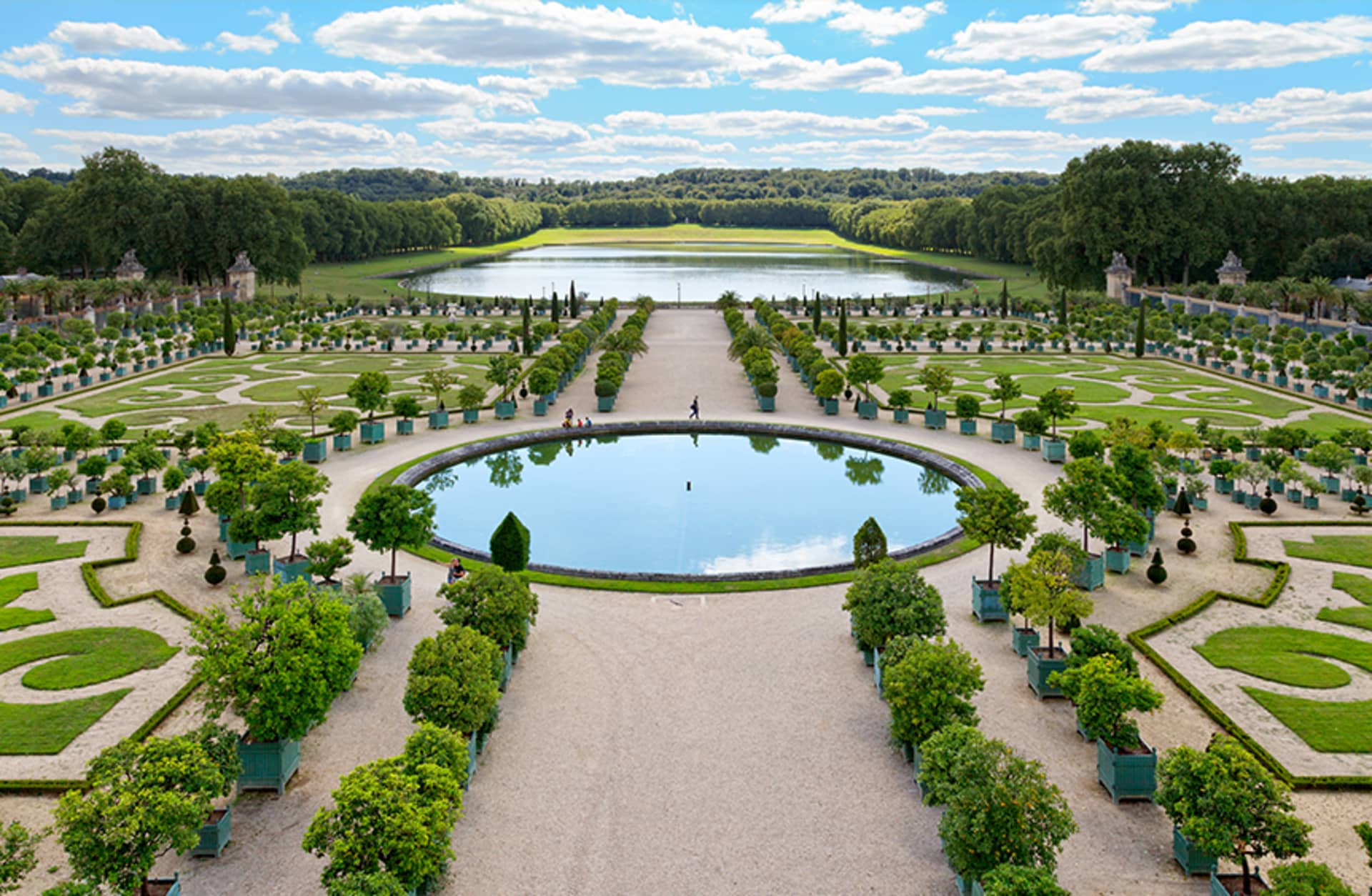 The gardens at Versailles, lined with orange trees.