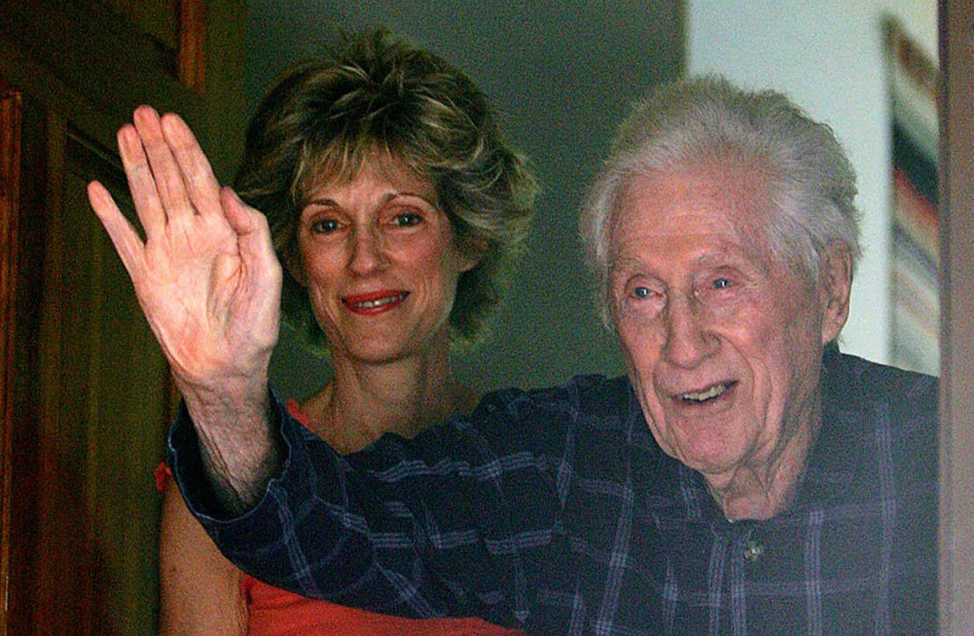 W. Mark Felt waving to the media gathered in front of his home beside his daughter Joan Felt, after breaking a 30 year silence on his identity as Deep Throat during the Watergate scandal. (Credit: Ben Margot/AP Photo)