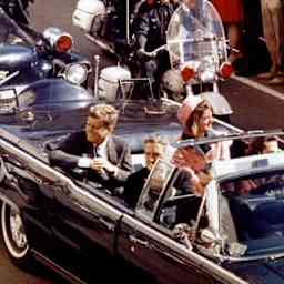 John and Jacqueline Kennedy ride through Dallas, Texas, on November 22, 1963.