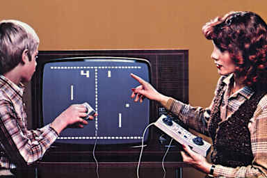 First video game 'Pong," mother with son, Germany, circa 1976