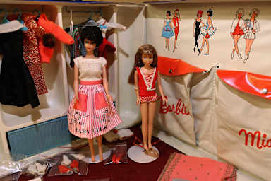 A vintage Barbie and Midge with carrying case.