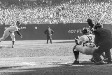 Pitcher Don Larson of the New York Yankees delivers the first pitch to Jim Gilliam of the Brooklyn Dodgers as catcher Yogi Berra and umpire Babe Pinelli look on during Game 5 of the 1956 World Series on October 8, 1956 at Yankee Stadium. Larson would go on to pitch a perfect game against the Dodgers. (Photo by Stanley Weston/Getty Images)