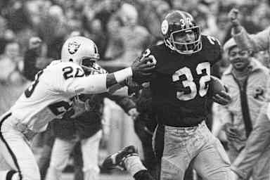 In this Dec. 23, 1972, file photo, Pittsburgh Steelers' Franco Harris (32) eludes a tackle by Oakland Raiders' Jimmy Warren as he runs 42-yards for a touchdown after catching a deflected pass during an AFC Divisional NFL football playoff game in Pittsburgh. Harris' scoop of a deflected pass and subsequent run for the winning touchdown, forever known as the "Immaculate Reception." (AP Photo/Harry Cabluck, File)