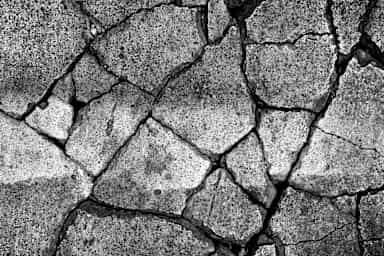 A shattered road after an earthquake.