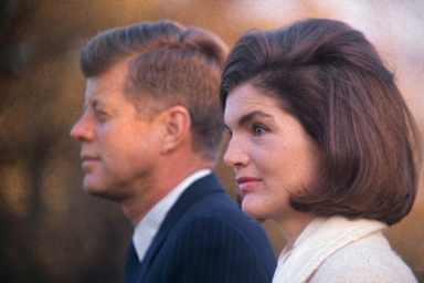 John F. Kennedy and Jackie Kennedy are shown on the White House lawn.