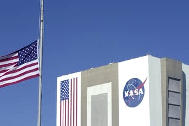Flag flies at half-staff at the Kennedy Space Center in Cape Canaveral on the day after seven astronauts died in the explosion of the space shuttle Columbia on its way to a landing in Florida.