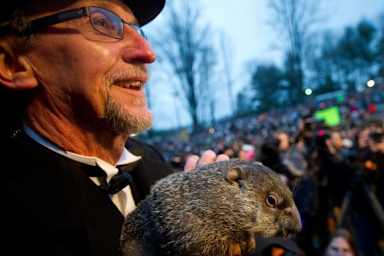 A groundhog handler holds Punxsutawney Phil after his 2012 weather prediction in Punxsutawney, Pennsylvania. 