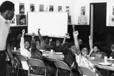 A teacher and his at a Black Panther liberation school. (Credit: Bettmann Archive/Getty Images)