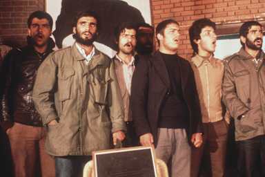 The Iranian students, who have occupied the U.S EmTEHRAN, IRAN - NOVEMBER 19: The Iranian students, who have occupied the U.S Embassy in Tehran, are singing during the second released group of U.S. Embassy staffers hold a press conference 19 November 1979, two days after Ayatollah Khomeini ordered the release of all women and black U.S. hostages. Fanatical followers of the Ayatollah Khomeini stormed the United States Embassy, 04 November 1979 in Tehran, occupied the building and took nearly 100 embassy staff and Marines hostages. (Photo credit should read H. KOTILAINEN/AFP via Getty Images)