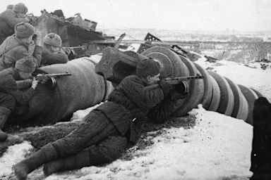 Armed with light machine guns, Soviet troops attack the German forces in the vicinity of the Red October plant in Stalingrad on November 26, 1942.