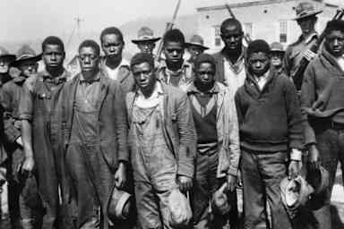 The accused Scottsboro Boys (left to right): Clarence Norris, Olen Montgomery, Andy Wright, Willie Roberson, Ozie Powell, Eugene Williams, Charlie Weems, Roy Wright, and Haywood Patterson. (Credit: Bettmann Archive/Getty Images)