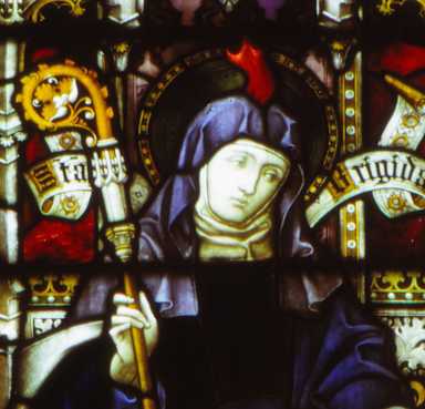 Medieval stained glass window showing Saint Brigit.