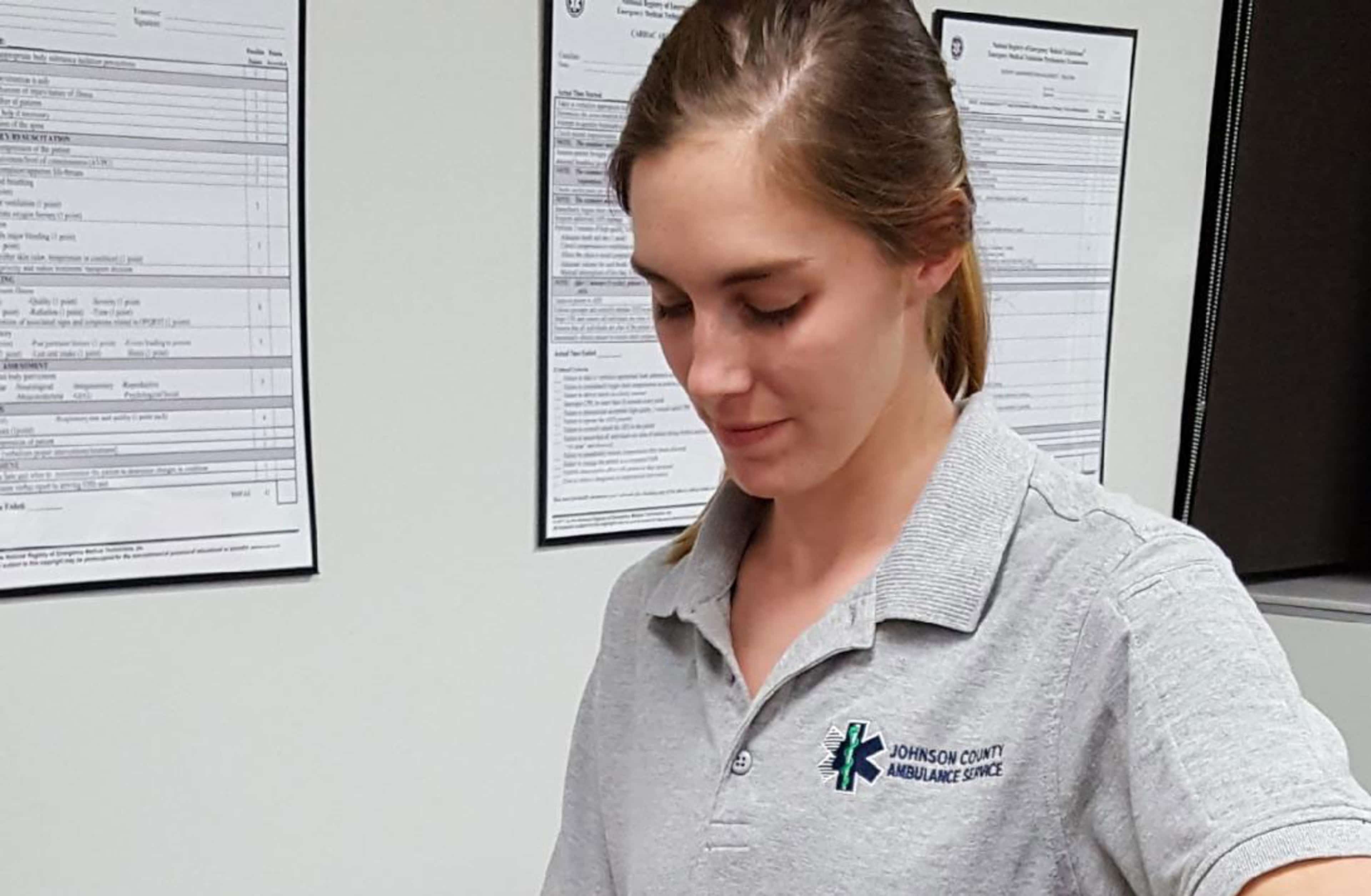 Catharine Found practices ventilations on co-worker Tiffany Schick suring a simulation set-up.