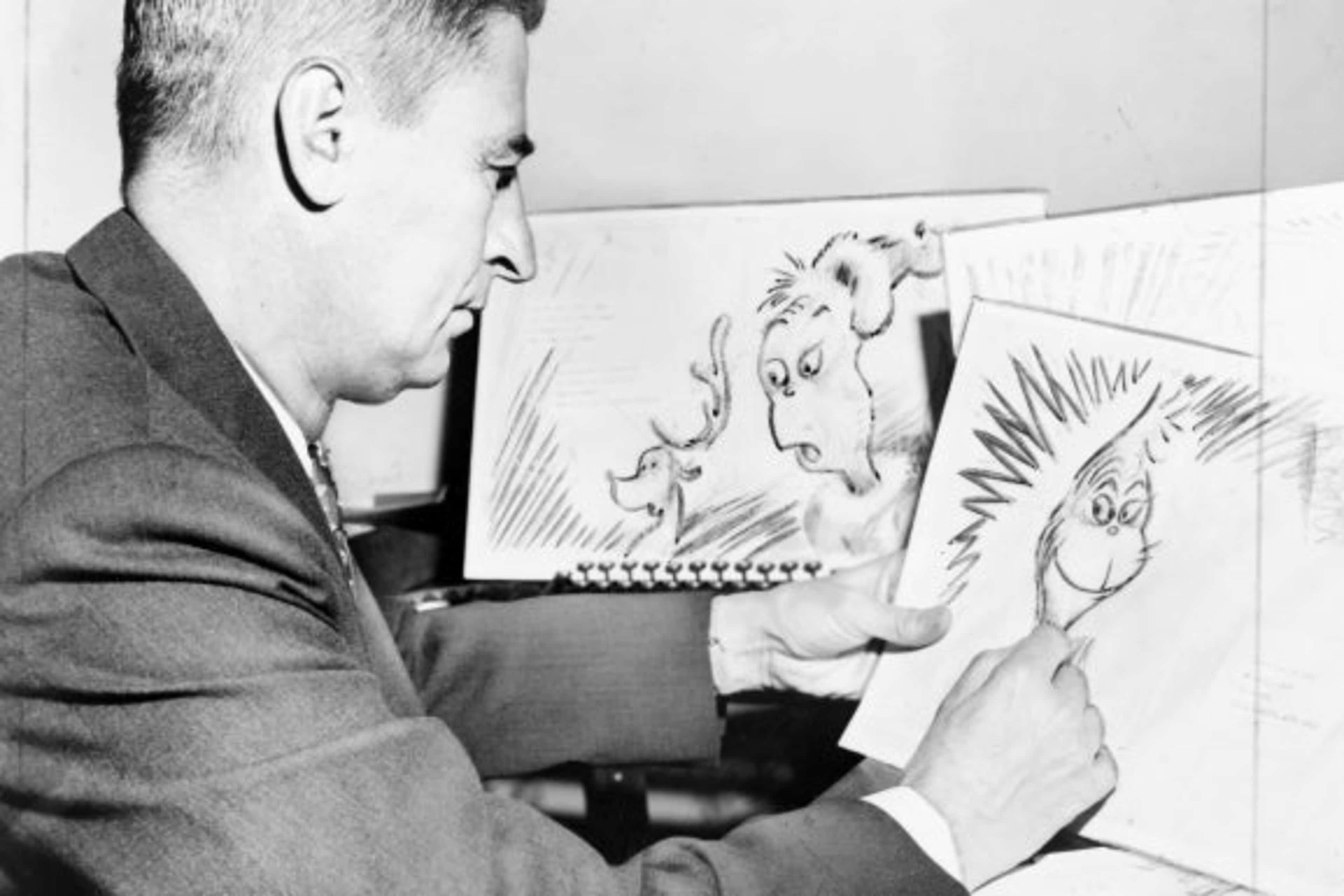 Theodor "Dr. Seuss" Geisel at work on a drawing for "How the Grinch Stole Christmas"