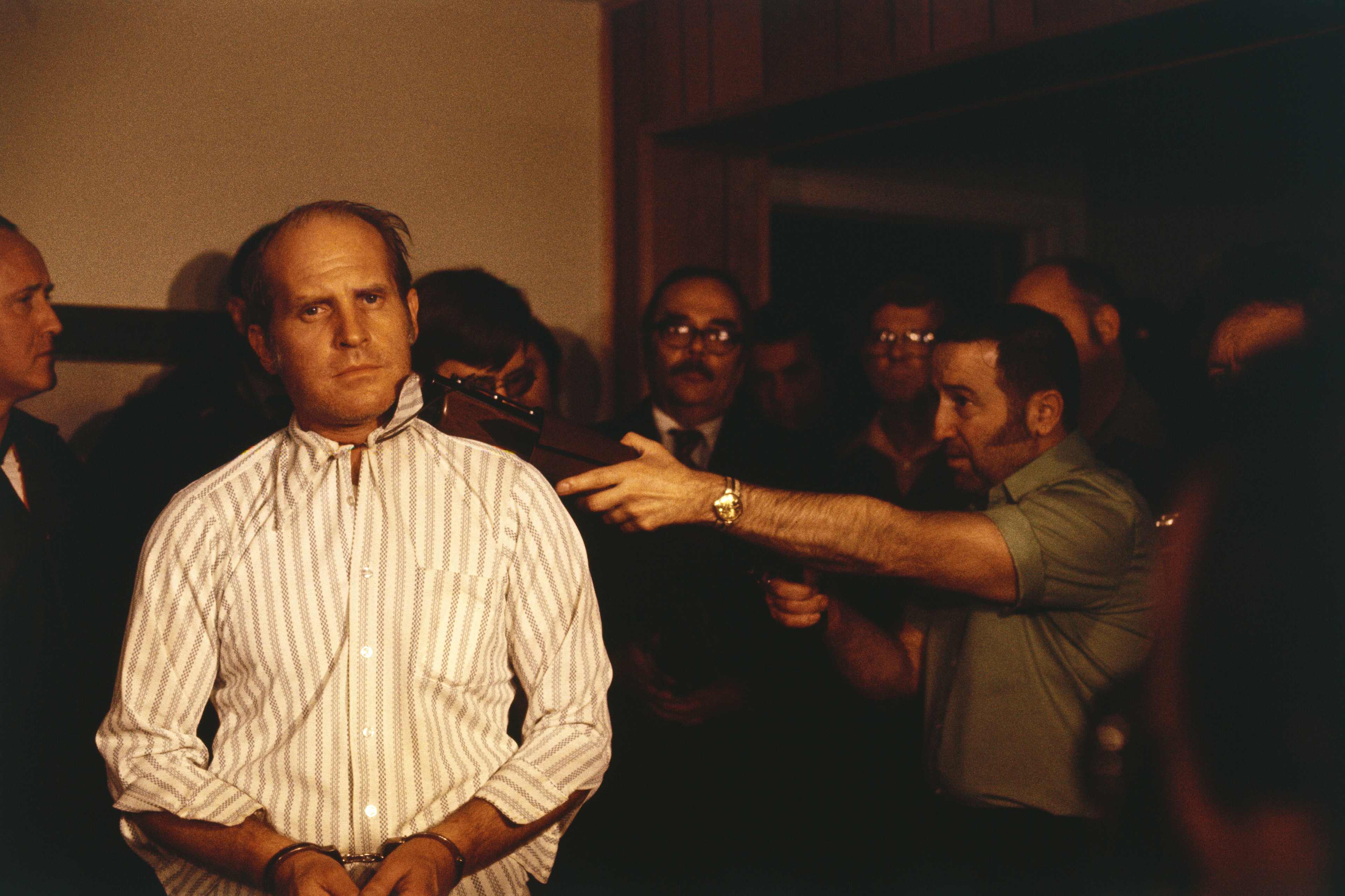 Man Holding Gun to Hostage