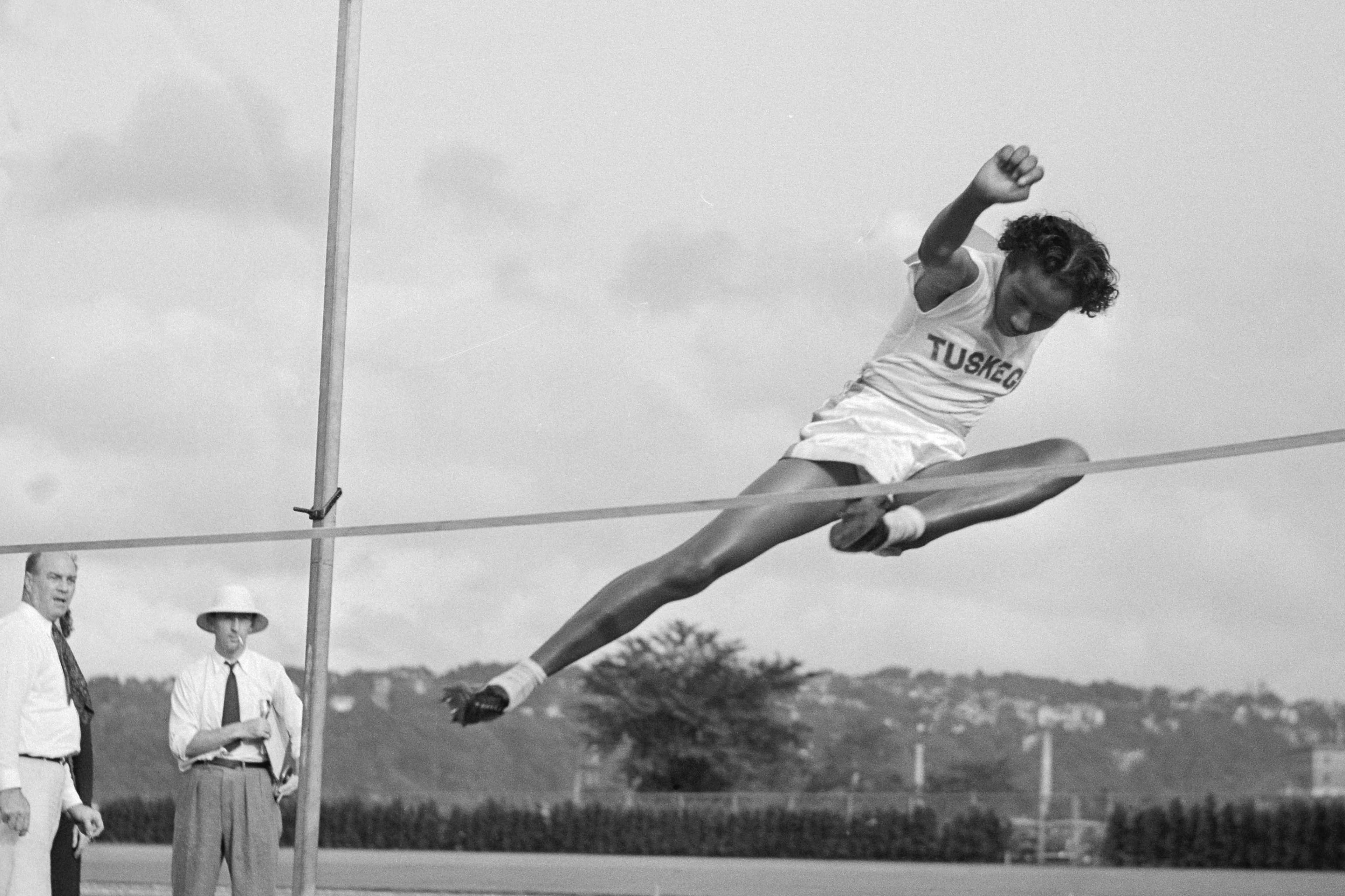 Alice Coachman performs in the high jump competition at the 1939 National Women's Track and Field meet.