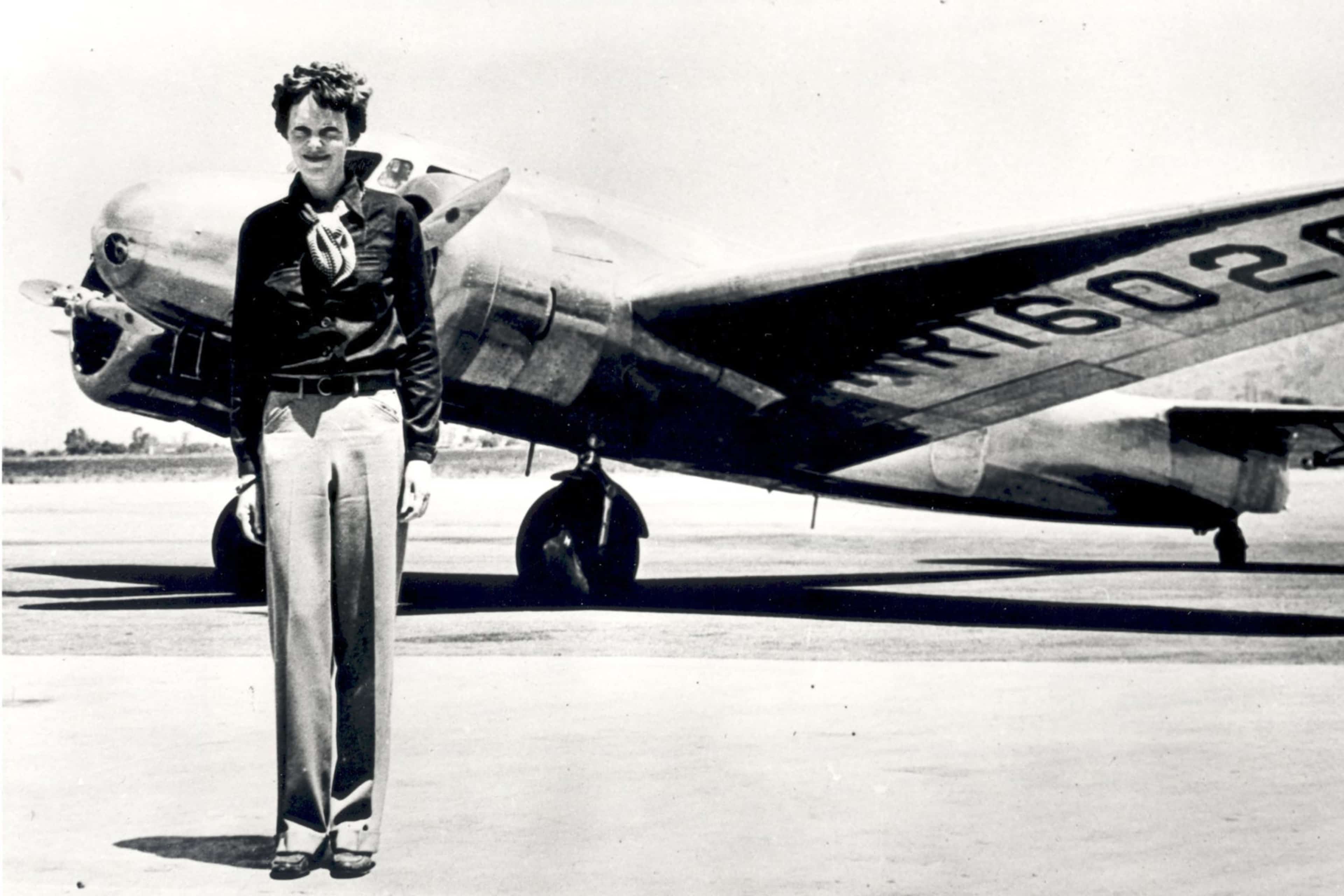 Amelia Earhart, pictured with the Lockheed Electra in which she disappeared in 1937.