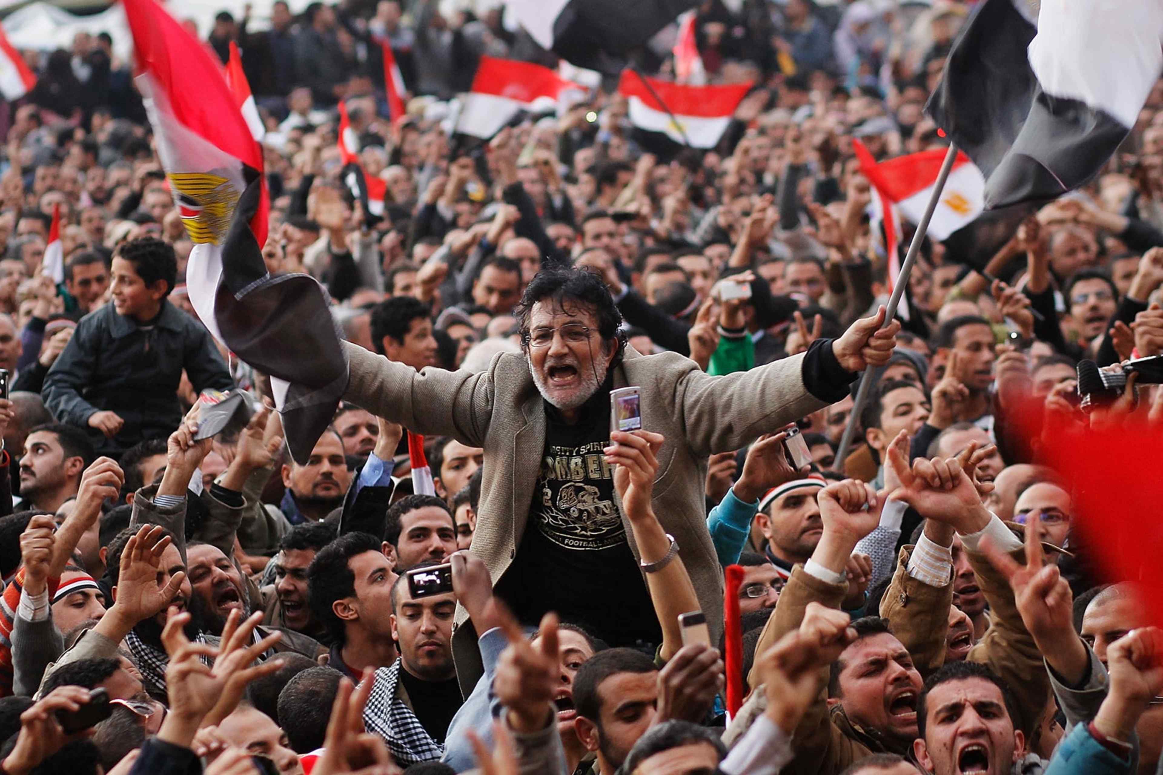 Crowds In Tahrir Square As Mubarak Prepares To Address Egyptians CAIRO, EGYPT - FEBRUARY 10: An anti-government protester is carried on shoulders in Tahrir Square in the afternoon before a speech by Egyptian President Hosni Mubarak in Tahrir Square February 10, 2011 in Cairo, Egypt. President Hosni Mubarak made a statement saying that he had given some powers to his vice President but would not resign or leave the country, leaving a crowd of anti-government protesters disappointed and furious after early reports he might step down. (Photo by Chris Hondros/Getty Images)