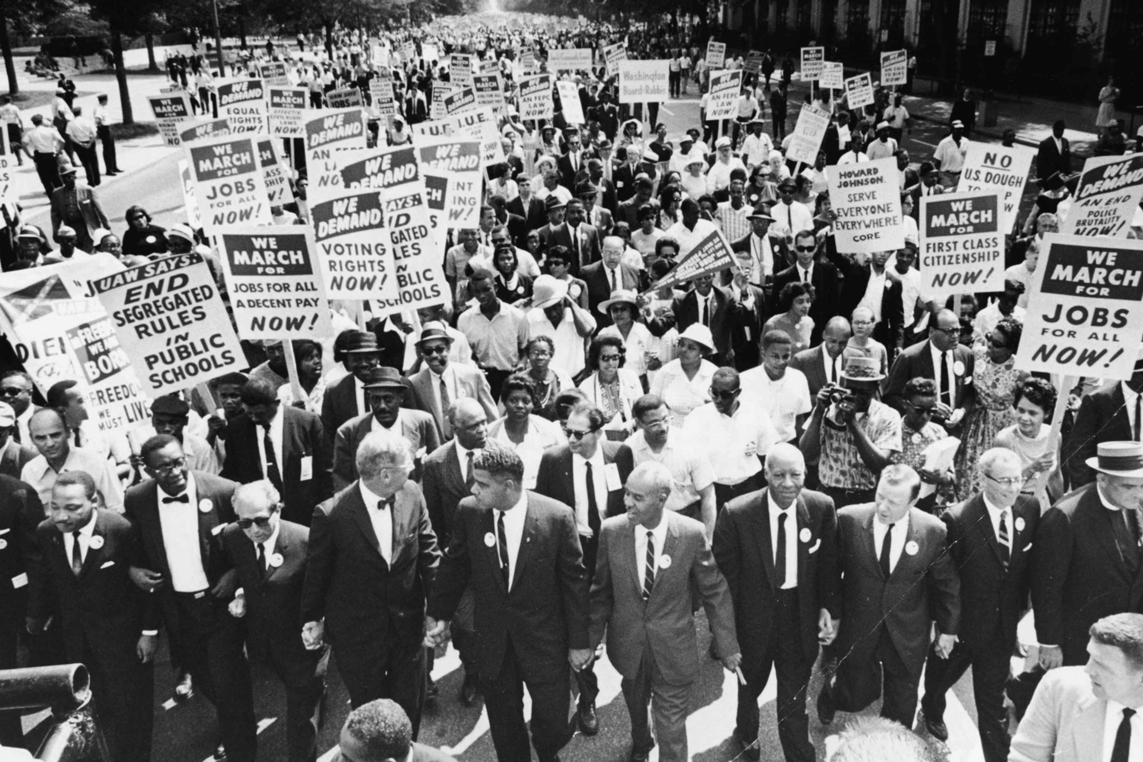 Civil Rights Leaders At The March On WashingtonCivil rights Leaders hold hands as they lead a crowd of hundreds of thousands at the March on Washington for Jobs and Freedom, Washington DC, August 28, 1963. Those in attendance include (front row): James Meredith and Martin Luther King, Jr. (1929 - 1968), left; (L-R) Roy Wilkins (1901 - 1981), light-colored suit, A. Phillip Randolph (1889 - 1979) and Walther Reuther (1907 - 1970). (Photo by Express/Hulton Archive/Getty Images)