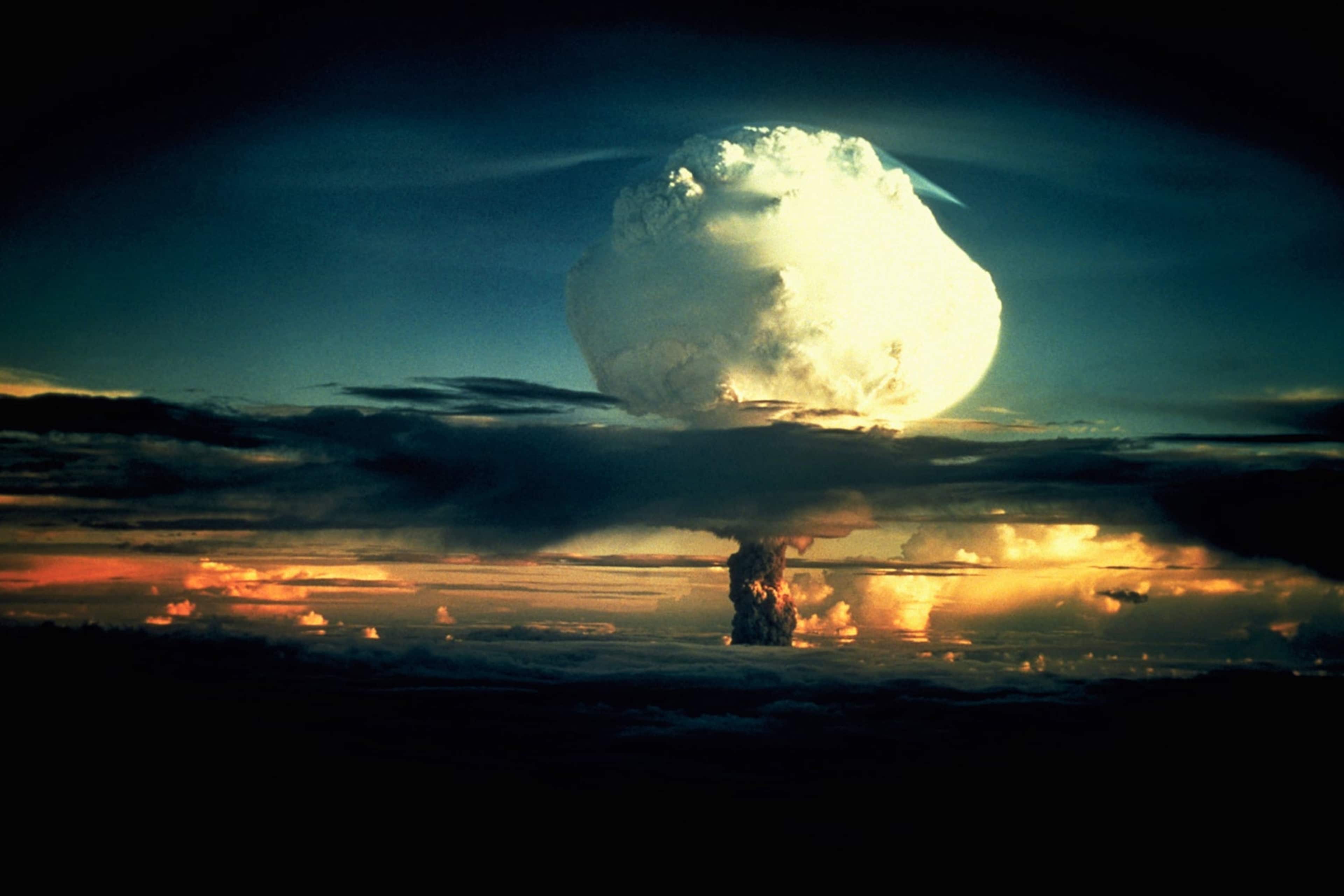 Operation Ivy Hydrogen Bomb Test in Marshall Islands A billowing white mushroom cloud, mottled with orange, pushes through a layer of clouds during Operation Ivy, the first test of a hydrogen bomb, at Enewetak Atoll in the Marshall Islands. (Photo by © CORBIS/Corbis via Getty Images)