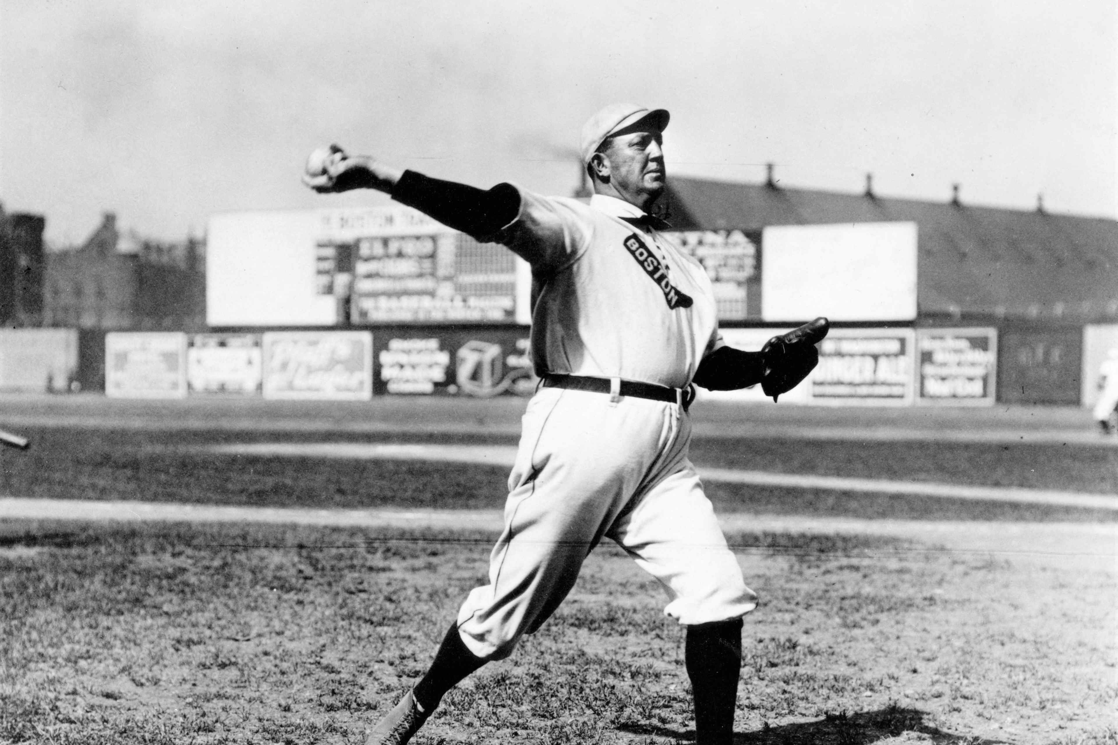 Cy Young, pitcher for the Boston Red Sox, warms up before a game at Huntingdon Ave. Grounds in Boston in 1908.