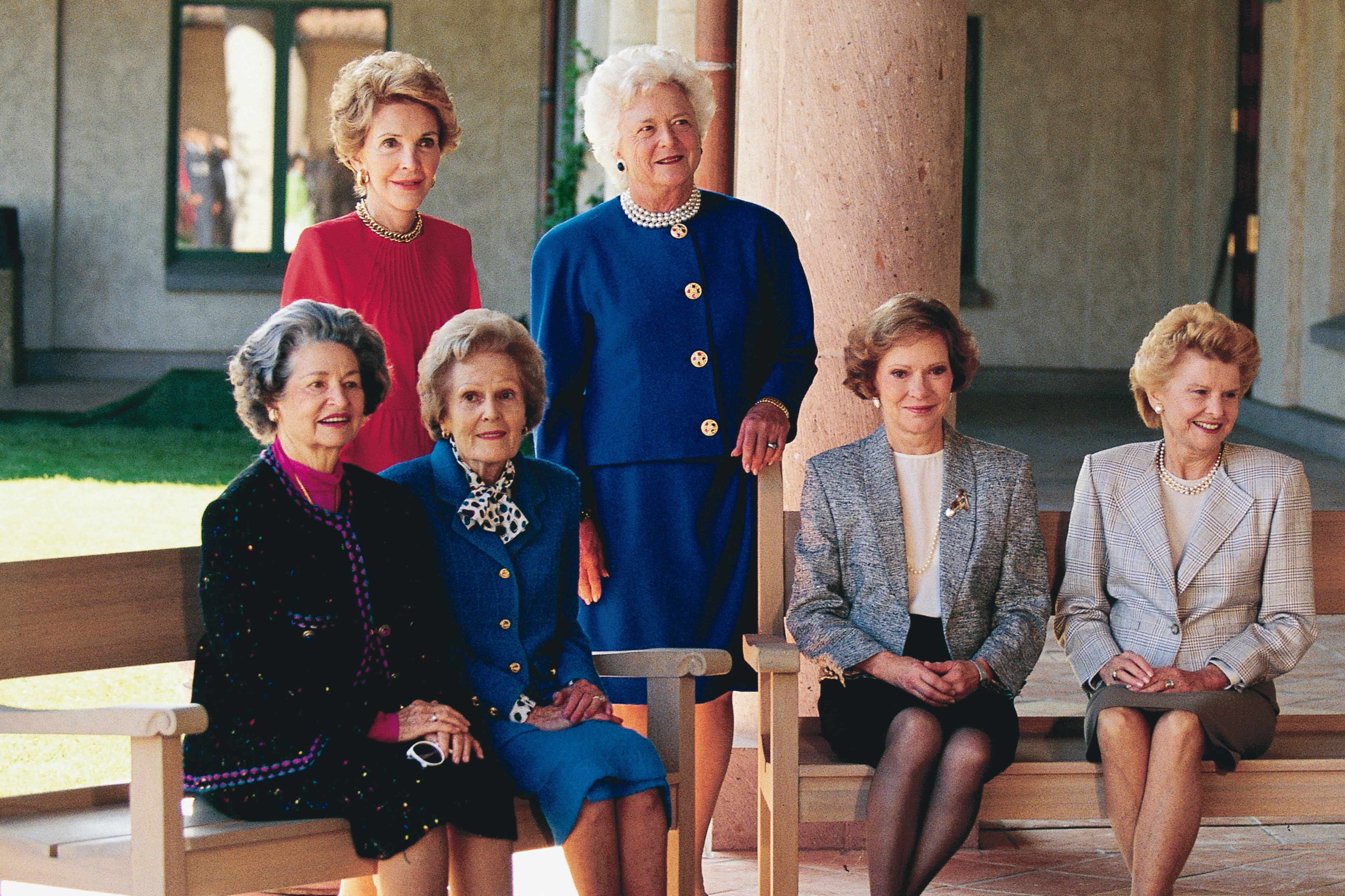 Portrait of former US First Ladies, seated from left, Lady Bird Johnson, Pat Nixon, Rosalynn Carter, and Betty Ford and, standing from left, Nancy Reagan and First Lady Barbara Bush, as they pose together at the opening of the Ronald Reagan Library, Simi Valley, California, November 4, 1991.