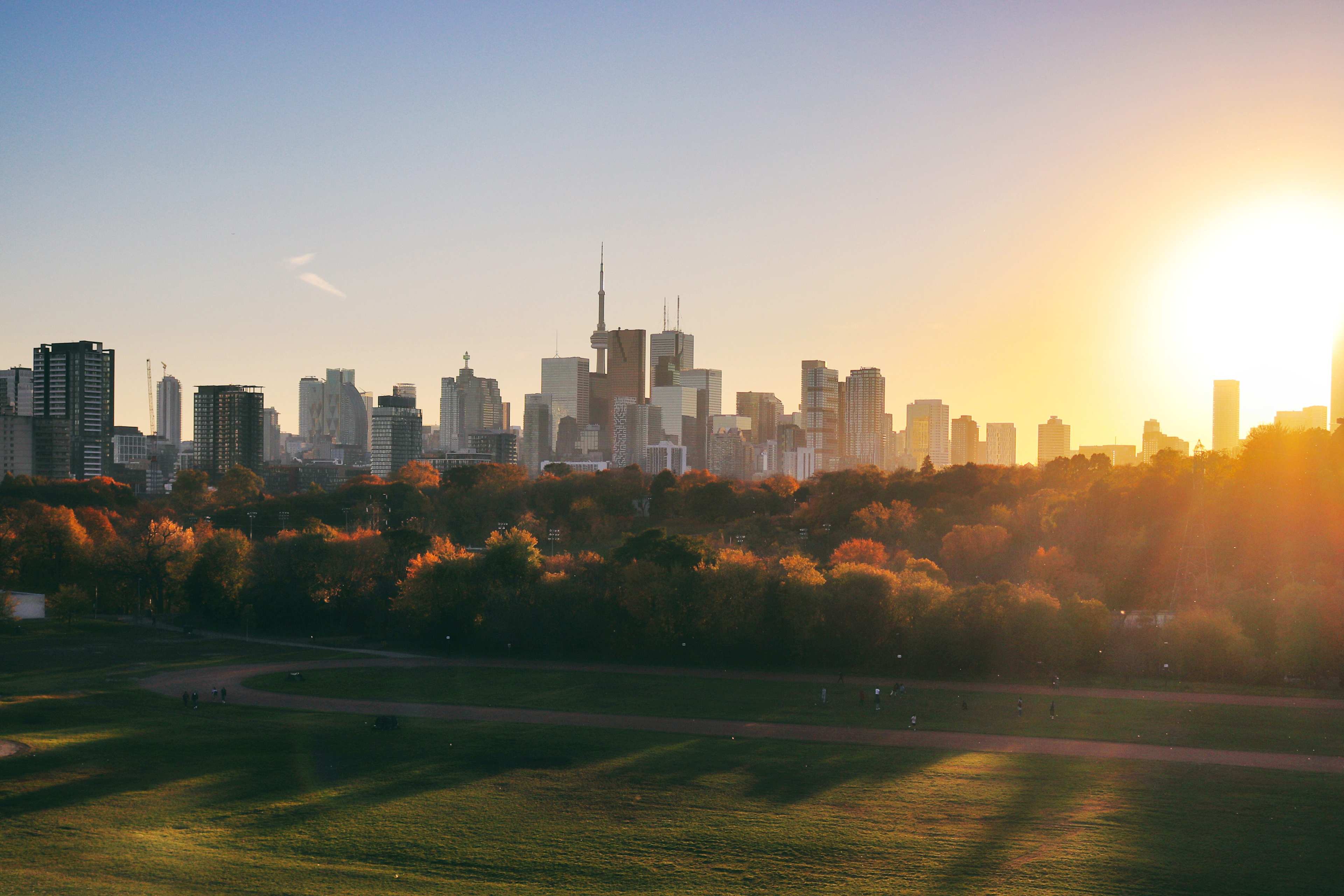 Gorgeous sunset in Toronto on a lovely day in November. The characteristic Toronto skyline with the famous CN tower grace the horizon. As seen from Riverdale Park East, Broadview.