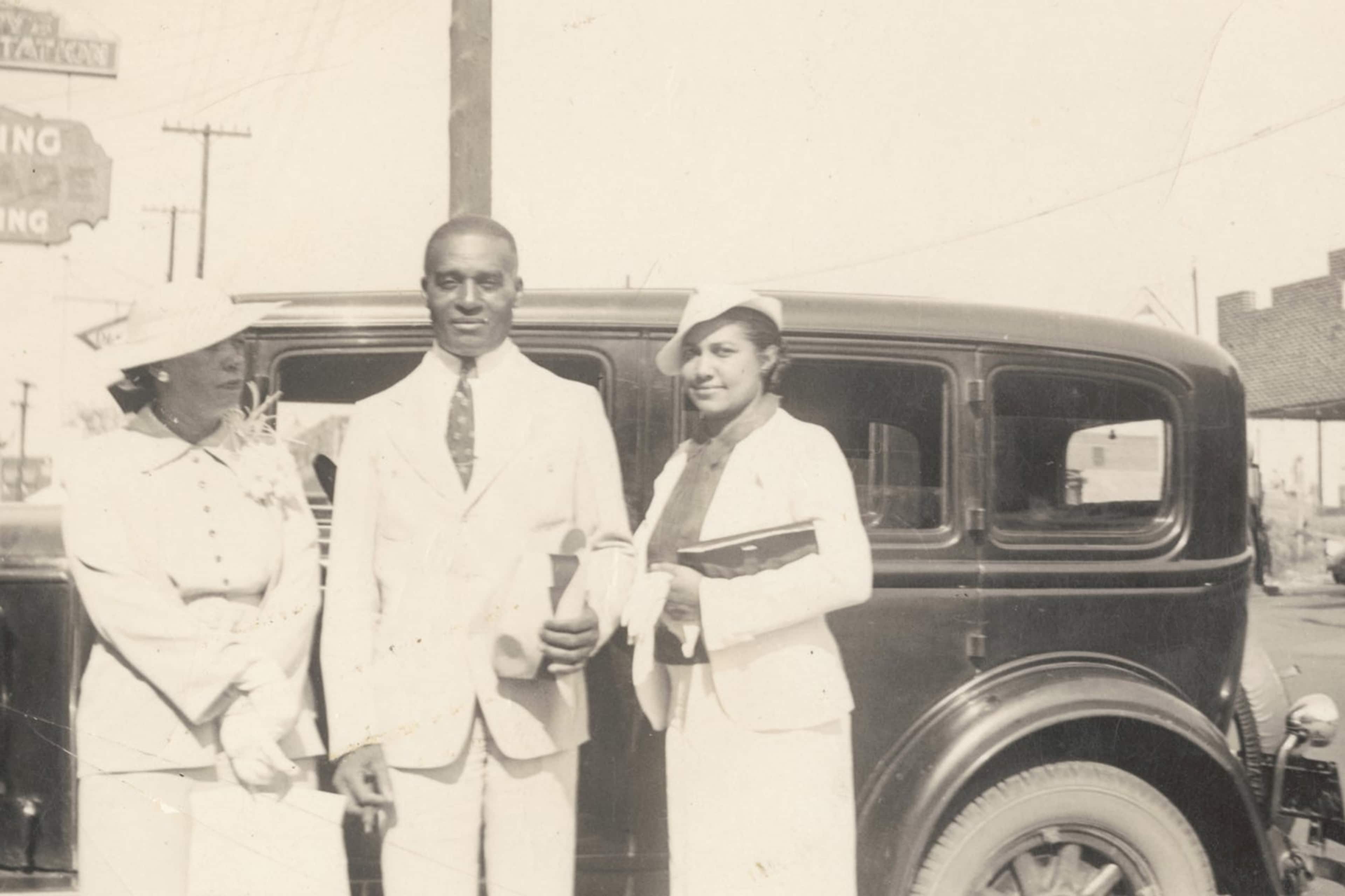 Customers stand outside Berry's Service Station in Tulsa.