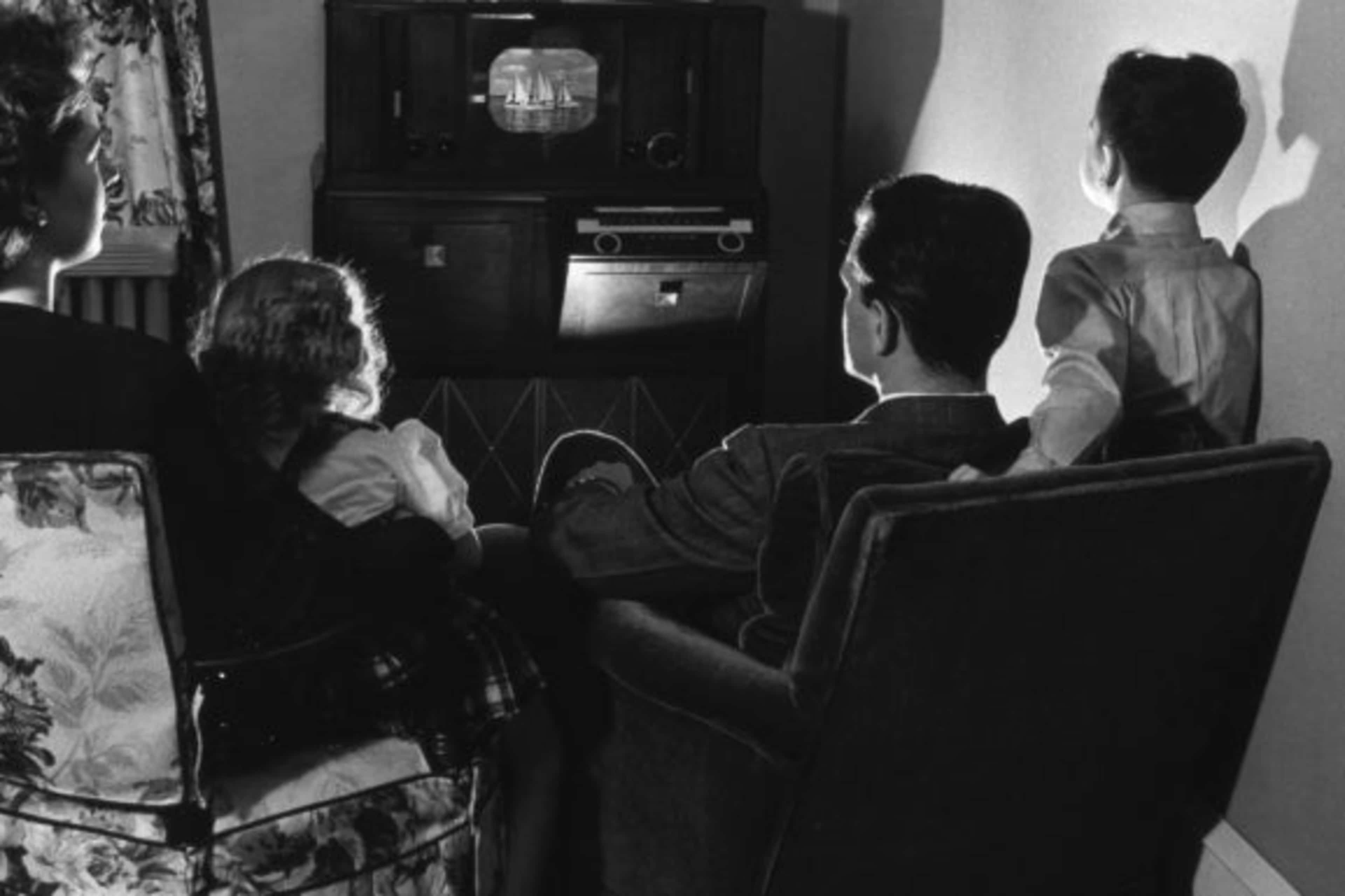 A family sitting around their television, 1945. (Credit: Harold M. Lambert/Getty Images)