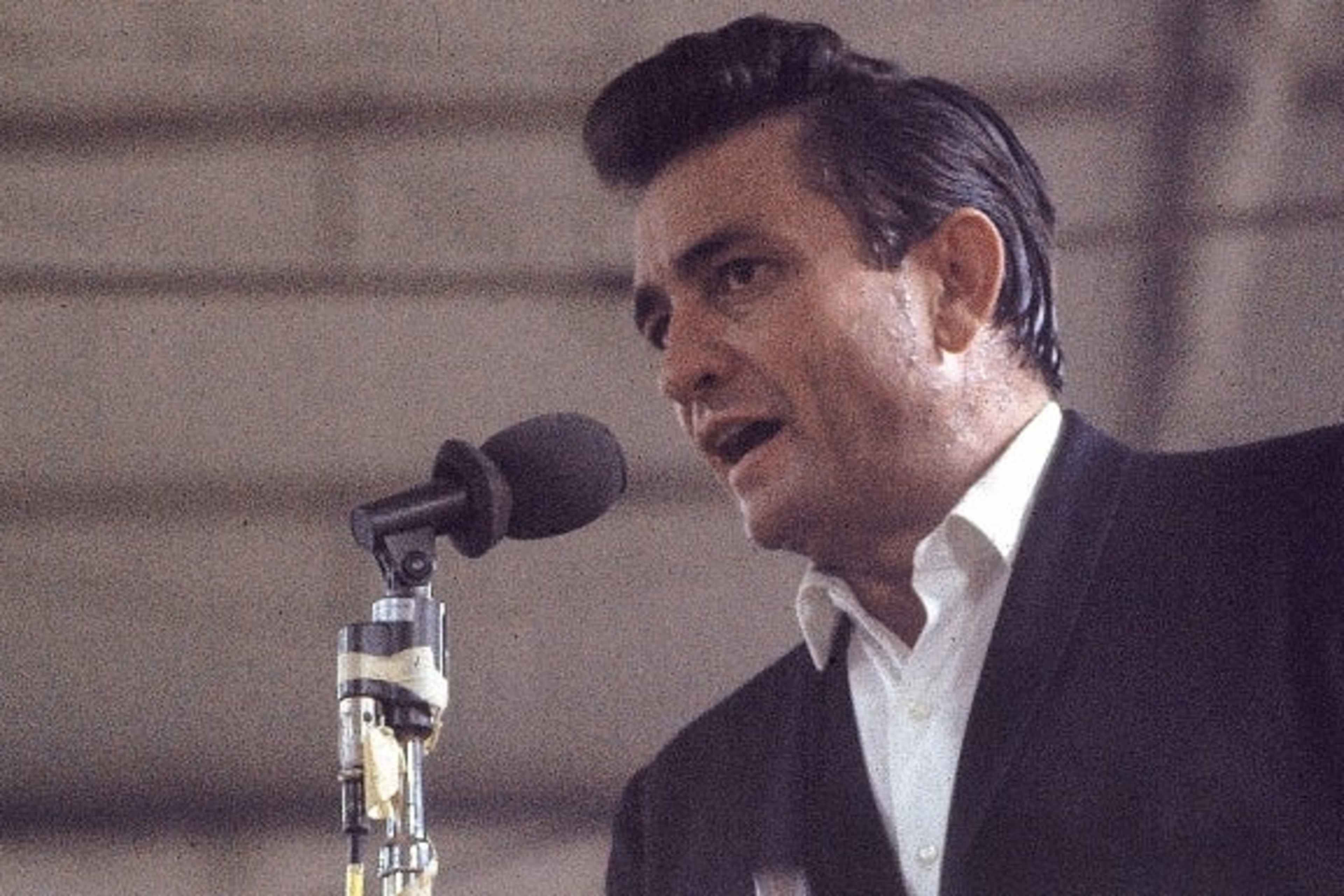 Country singer Johnny Cash performing for prisoners at the Folsom Prison in California on January 13, 1968. The performance was recorded for his live album "Johnny Cash at Folsom Prison."  (Credit: Dan Poush/AP Photo)