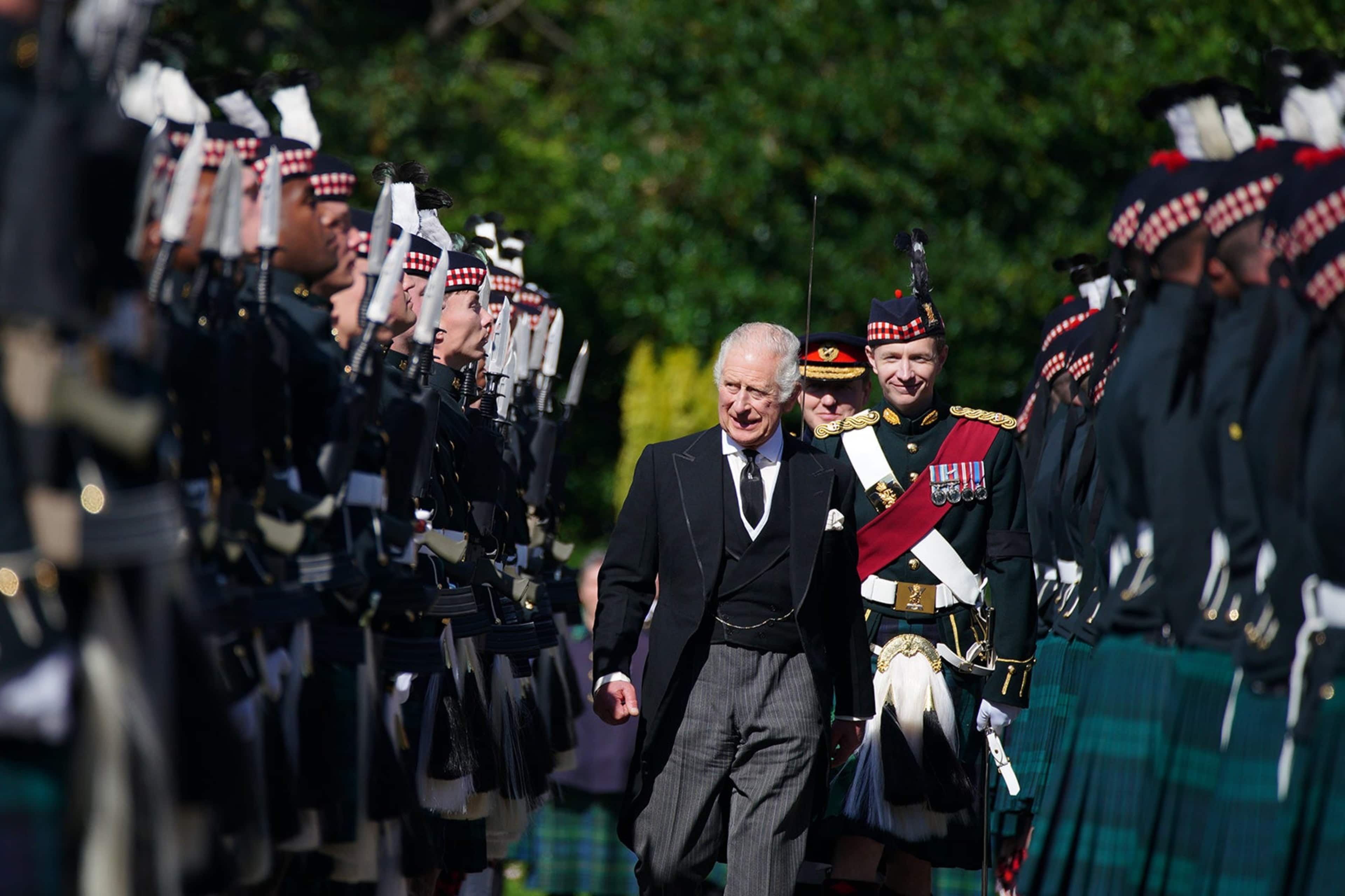 King Charles III inspects the Guard of Honour as he arrives for the Ceremony of the Keys at the Palace of Holyroodhouse, on September 12, 2022, in Edinburgh, Scotland.