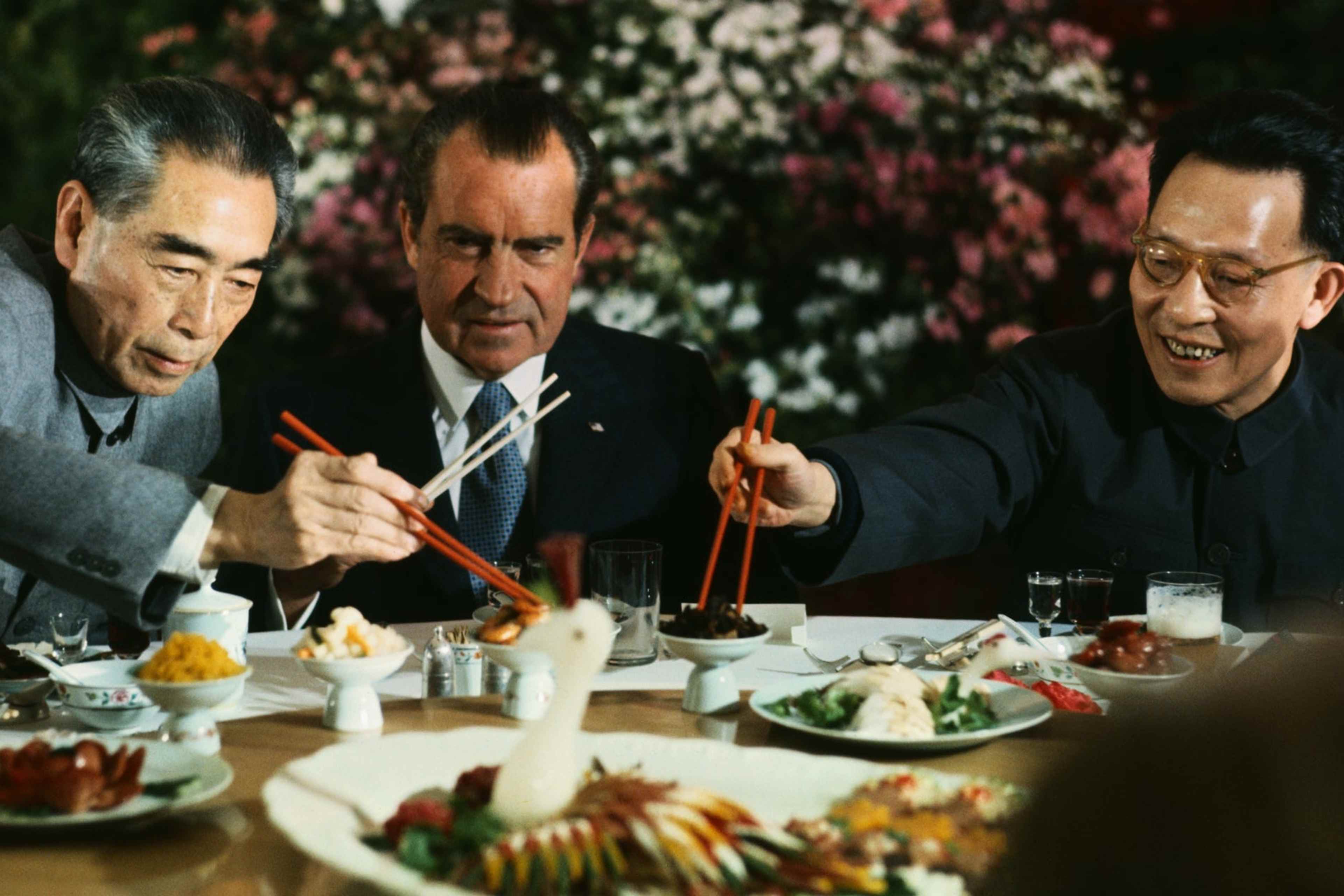President Richard Nixon shares a meal with Premier Chou En-lai (left) and Shanghai Communist Party leader Chang Chun-chiao on February 27, 1972.