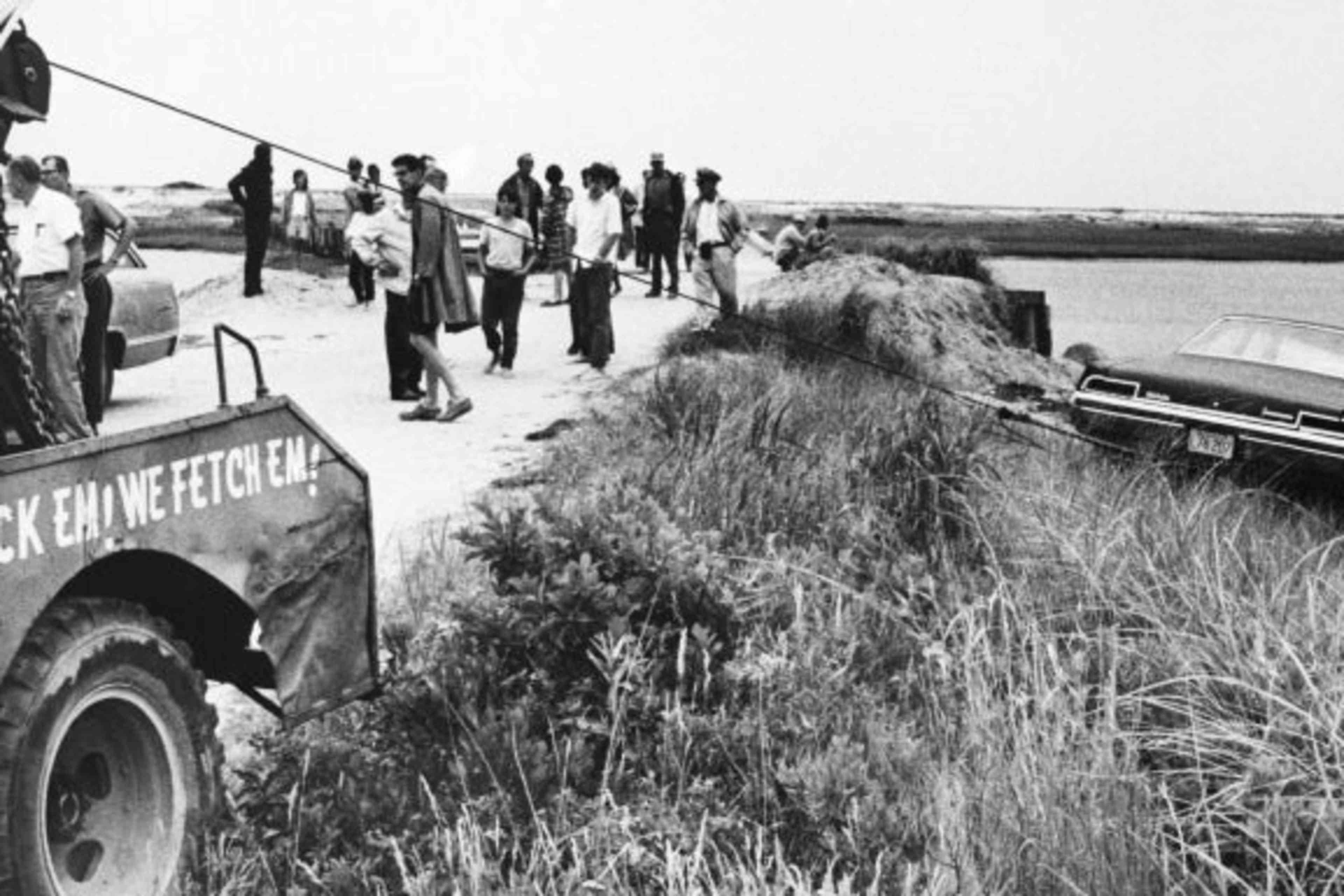 A tow truck pulling Senator Edward Kennedy's car out of Poucha Pond after the accident on Chappaquiddick Island that killed Mary Jo Kopechne. (Credit: Bettmann Archive/Getty Images)
