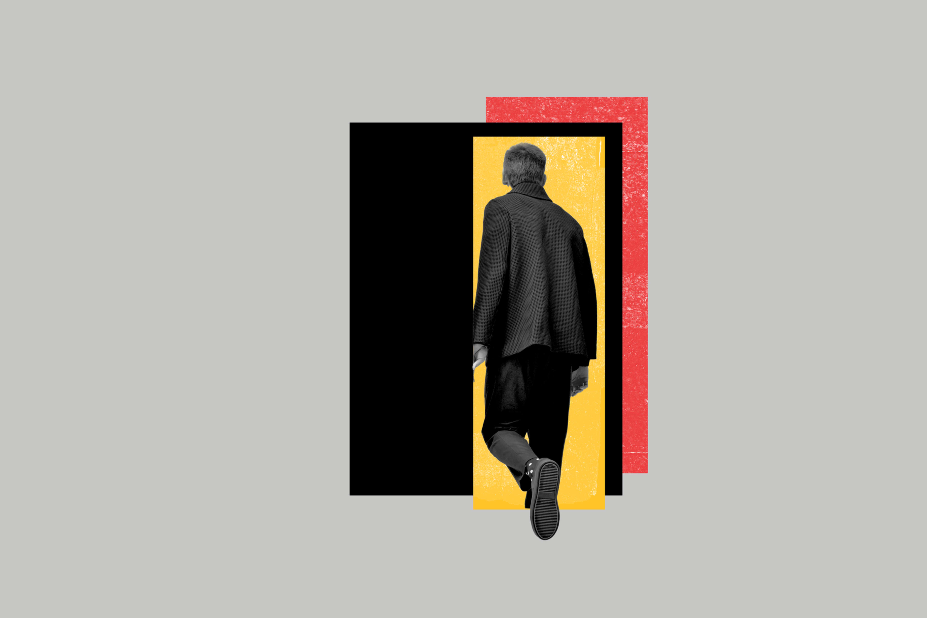 Image of a man walking through a door. 