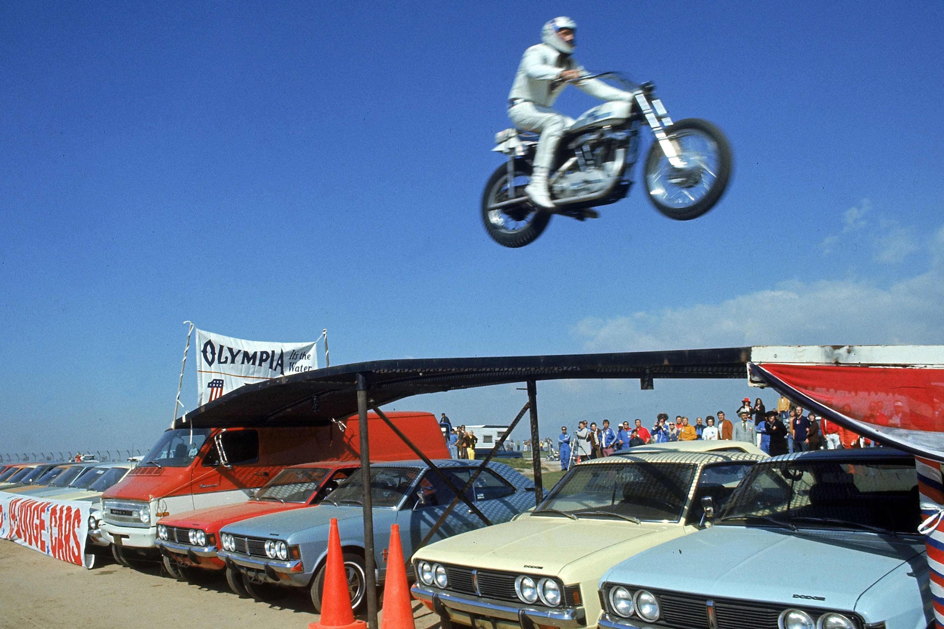 Evel Knievel mid-jump during a successful attempt to jump over a row of 19 cars, a record at the time, on February 28, 1971.