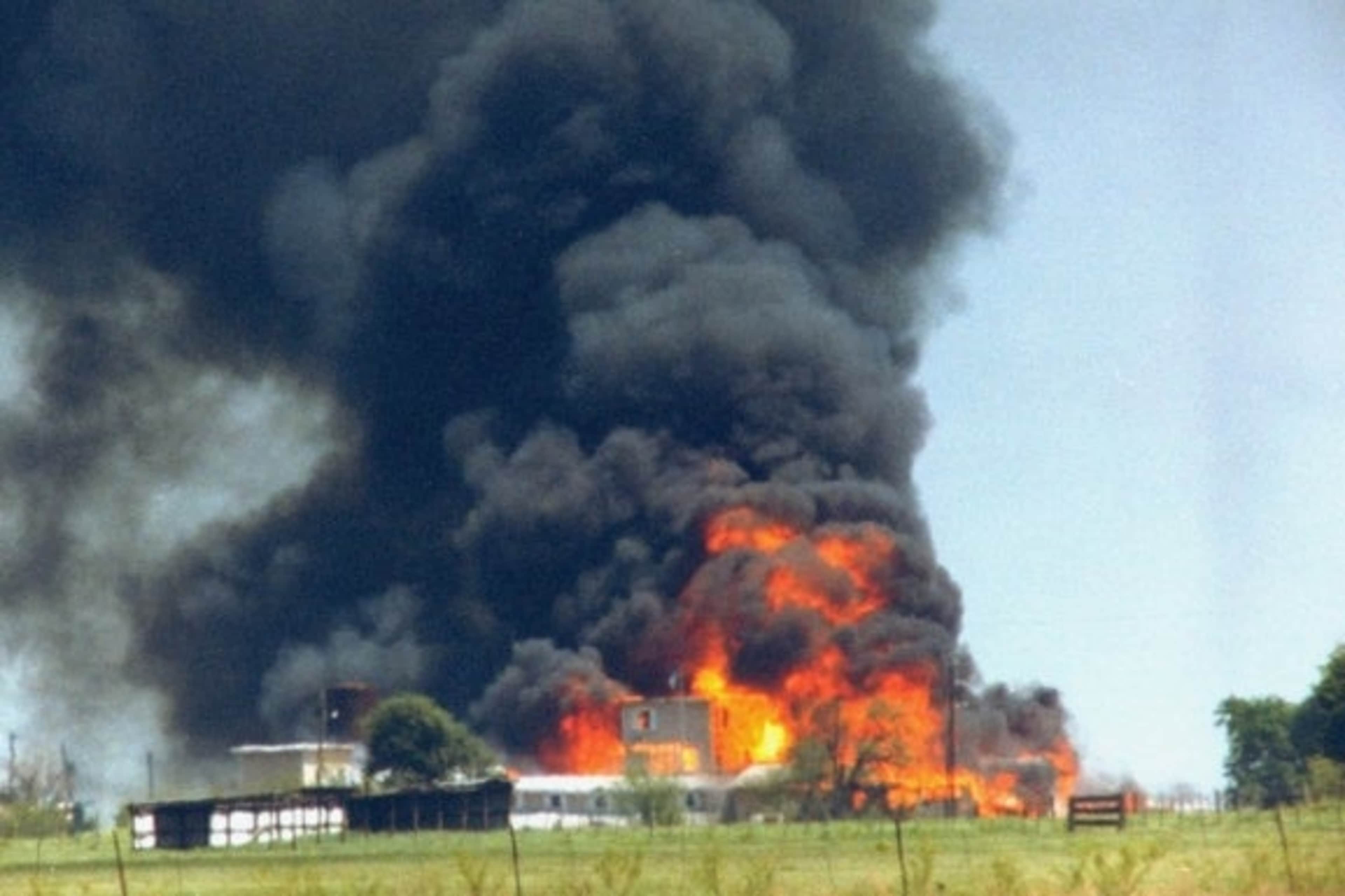 Fire and smoke consuming the David Koresh-led Branch Davidian cult compound, 1993.  (Credit: Mark Perlstein/The LIFE Images Collection/Getty Images)