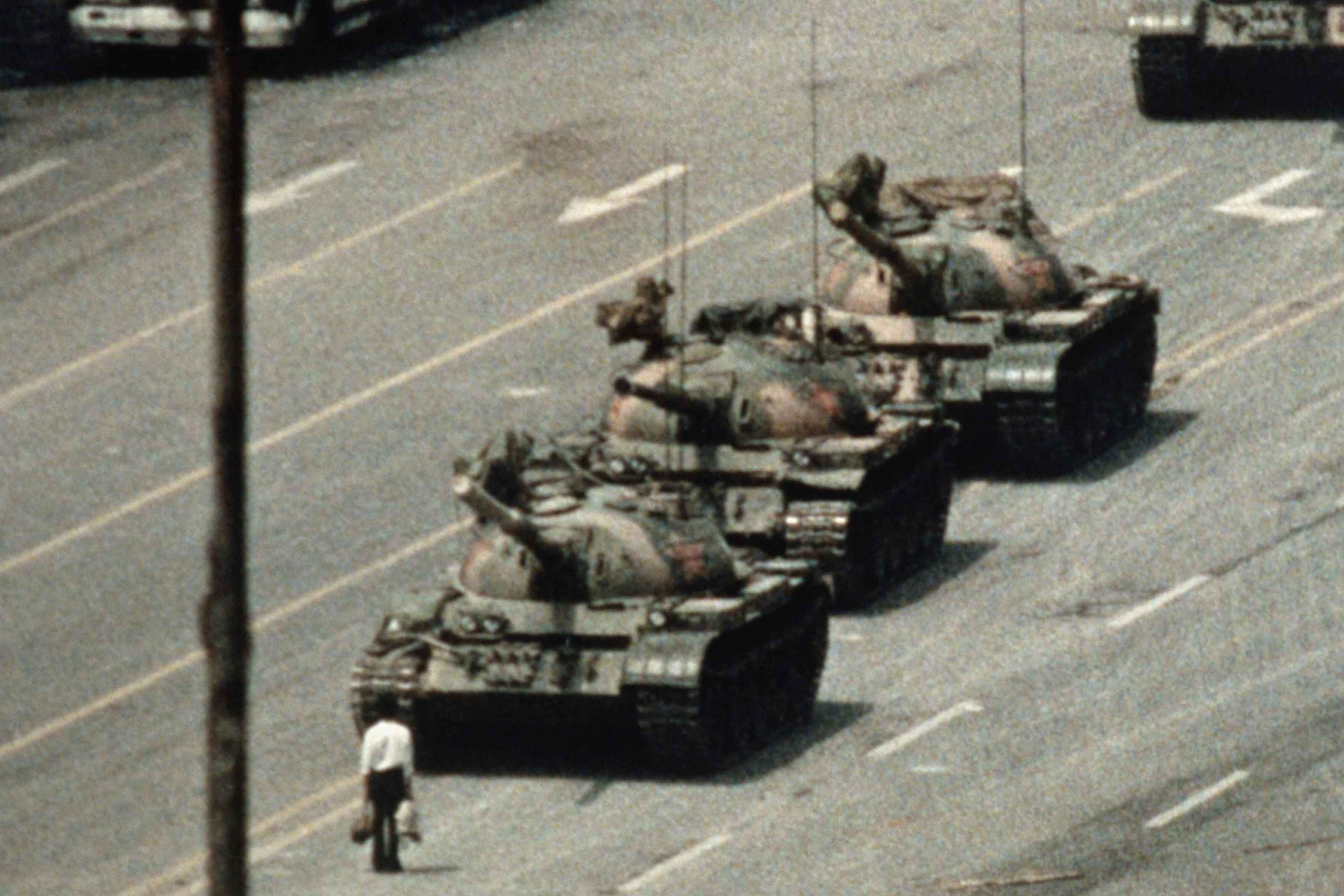 A Beijing demonstrator blocks the path of a tank convoy along the Avenue of Eternal Peace near Tiananmen Square during protests for freedom of speech and of press from the Chinese government. (Credit: Bettmann Archive/Getty Images)