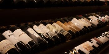 Rows of fine wine bottles on a shelf