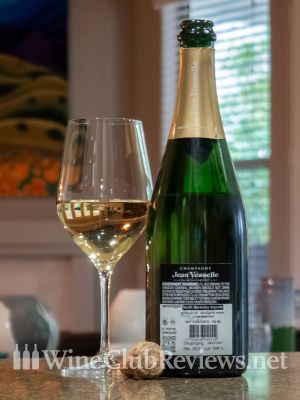 Jean Vesselle Brut Réserve NV Back of bottle with glass of wine