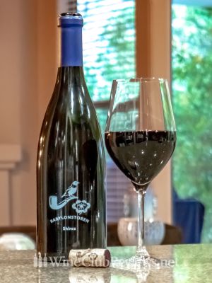 Babylonstoren Shiraz Front of bottle with glass of wine