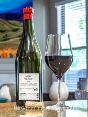 Moric Blaufränkisch Back of bottle with glass of wine