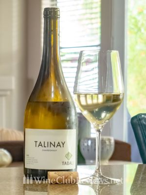 Tabalí Talinay Chardonnay front of bottle with glass of wine