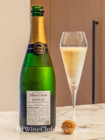 Mes Racines Brut: front of bottle with wine in glass