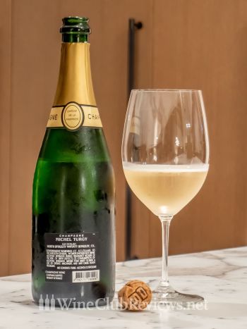 Blanc de Blancs Brut Réserve Sélection: front of bottle with wine in glass