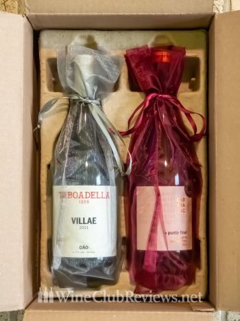 Gift-wrapped wine bottles unboxing