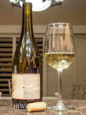 Rick Boyer Unoaked Chardonnay: front of bottle with wine in glass